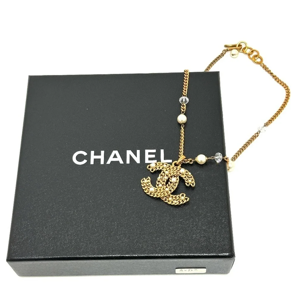CHANEL Gold Pearl Logo Necklace